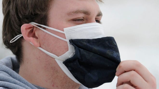 Wearing two masks