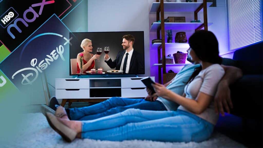 Couple watching streaming services on TV at home.