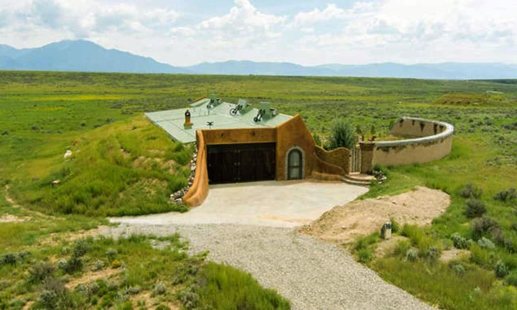 Earth-sheltered home blending into the landscape, designed for energy efficiency and sustainability