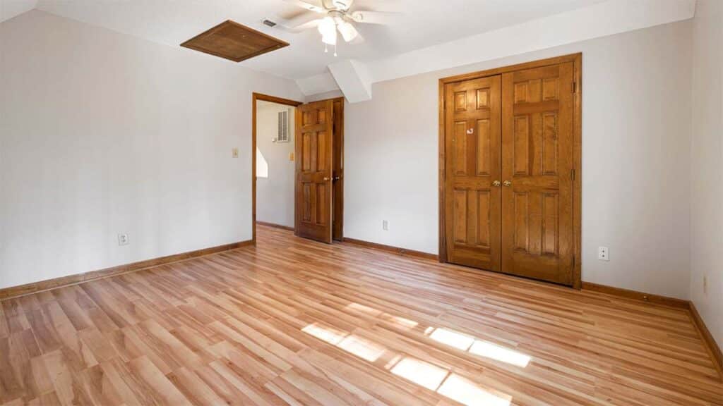 Light wood flooring and neutral-colored walls