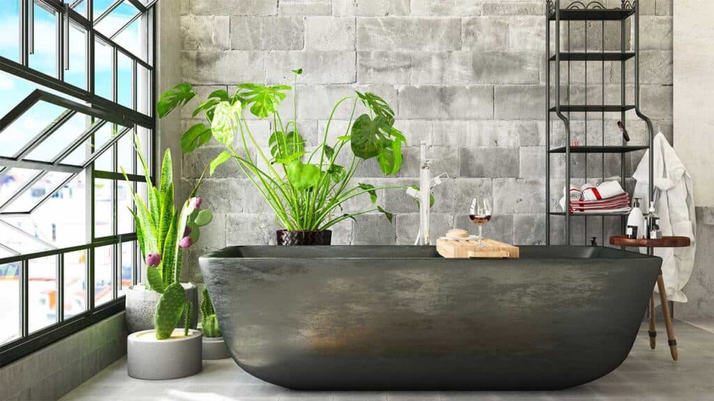 A modern bathroom features a black freestanding bathtub
